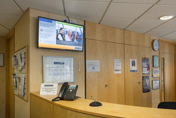 Digital Signage Screen in small business reception area